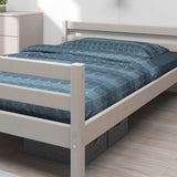 FLEXA single grey bed, 140x200 cm, blue geometric bedding, light wood minimalist bedroom, child-safe rounded edges.