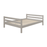 FLEXA CLASSIC grey pine single bed with slatted base, headboard, and footboard in a child’s bedroom.