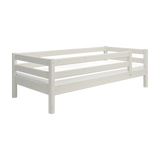 FLEXA WHITE children’s single bed with safety rail, Scandinavian design, all-white finish, shown on a plain white background.