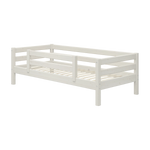FLEXA single bed from WHITE collection, solid pine, white finish with safety rail and slatted base in child’s bedroom.
